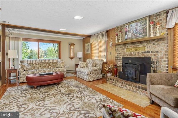 Fireplace, Interior, Living room, Recessed Lighting, Stone Walls, Wood Texture Flooring