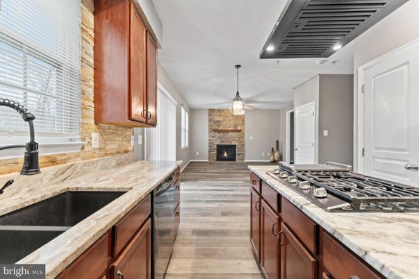 Fireplace, Interior, Kitchen, Pendant Lights, Recessed Lighting, Stone Walls, Wood Texture Flooring
