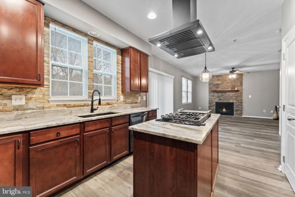 Fireplace, Interior, Kitchen, Pendant Lights, Recessed Lighting, Stone Walls, Wood Texture Flooring
