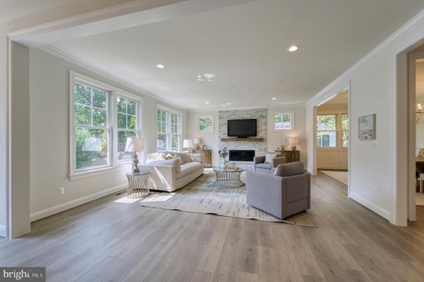 Fireplace, Interior, Living room, Recessed Lighting, Stone Walls, Wood Texture Flooring