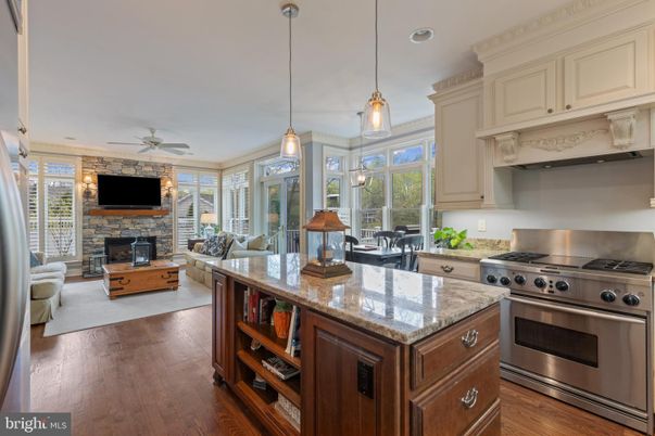 Dining room, Fireplace, Interior, Kitchen, Living room, Pendant Lights, Recessed Lighting, Stainless Steel Appliances, Stone Walls, Wood Texture Flooring