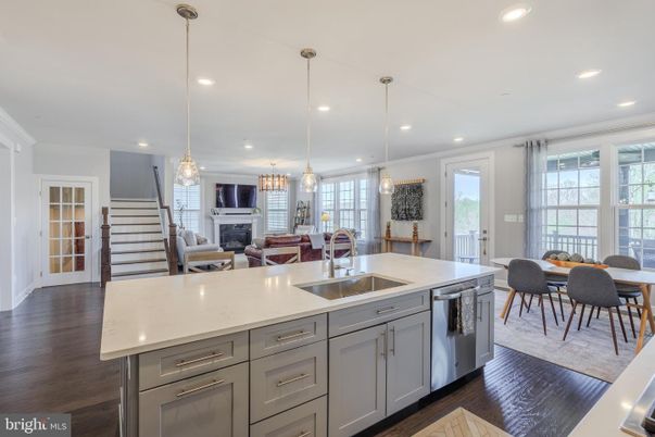 Dining room, Fireplace, Interior, Kitchen, Living room, Pendant Lights, Recessed Lighting, Stainless Steel Appliances, Wood Texture Flooring