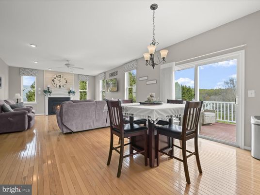 Chandelier, Dining room, Fireplace, Interior, Living room, Pendant Lights, Recessed Lighting, Wood Texture Flooring