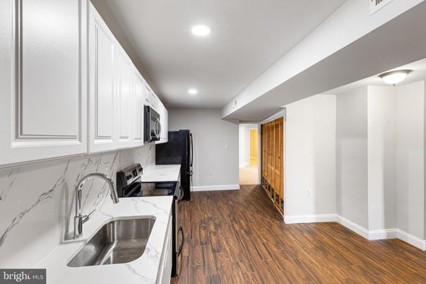 Interior, Kitchen, Marble Walls, Recessed Lighting, Wood Texture Flooring