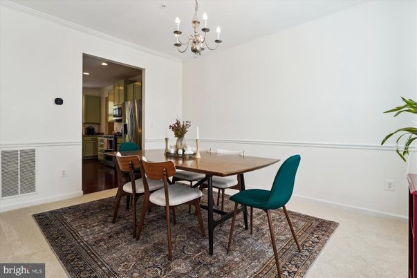 Chandelier, Dining room, Interior, Kitchen, Recessed Lighting, Stainless Steel Appliances, Wood Texture Flooring