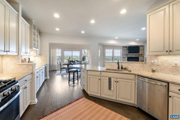 Dining room, Fireplace, Interior, Kitchen, Recessed Lighting, Stainless Steel Appliances, Wood Texture Flooring