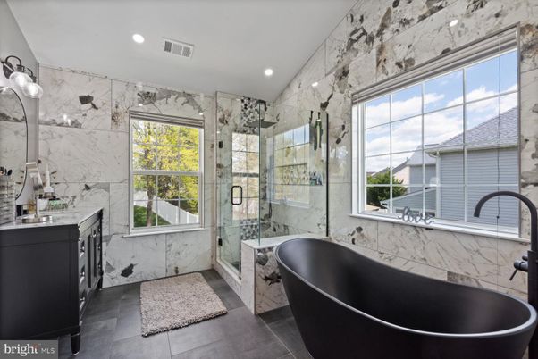 Bathroom, Dual Sink Vanities, Free Standing Baths, Glass Shower, Interior, Marble Walls, Recessed Lighting