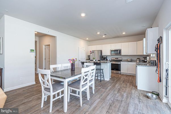 Dining room, Interior, Kitchen, Recessed Lighting, Stainless Steel Appliances, Wood Texture Flooring