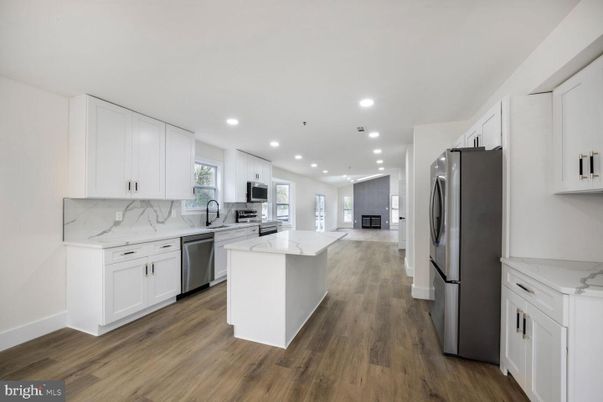 Interior, Kitchen, Marble Walls, Recessed Lighting, Stainless Steel Appliances, Wood Texture Flooring