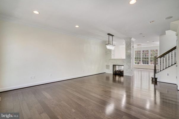 Chandelier, Empty room, Fireplace, Interior, Pendant Lights, Recessed Lighting, Wood Texture Flooring