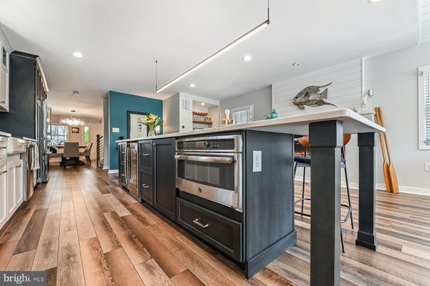 Chandelier, Dining room, Interior, Kitchen, Pendant Lights, Recessed Lighting, Stainless Steel Appliances, Wood Texture Flooring