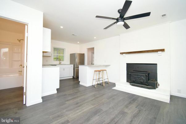 Fireplace, Interior, Kitchen, Recessed Lighting, Wood Texture Flooring