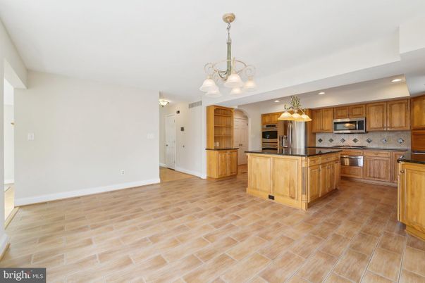 Chandelier, Interior, Kitchen, Recessed Lighting, Stainless Steel Appliances, Wood Texture Flooring