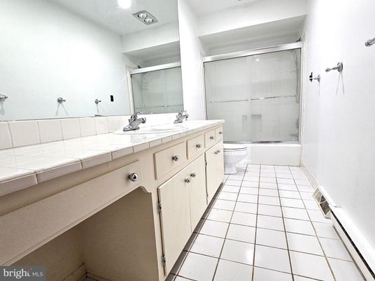 Bathroom, Dual Sink Vanities, Glass Shower, Interior, Recessed Lighting, Tile Countertops