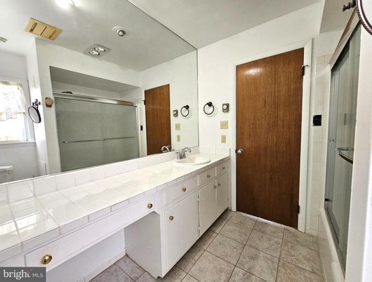 Bathroom, Dual Sink Vanities, Glass Shower, Interior, Recessed Lighting, Tile Countertops