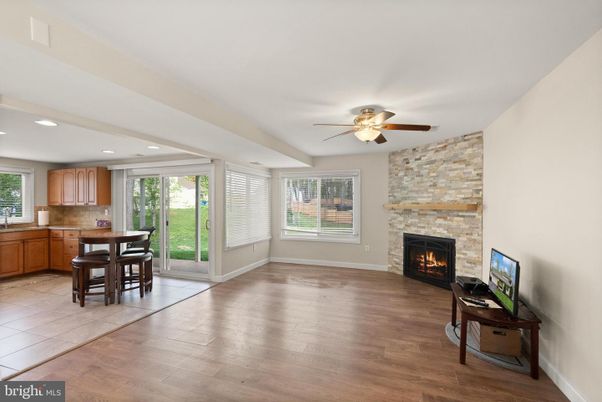 Fireplace, Interior, Kitchen, Recessed Lighting, Stone Walls, Wood Texture Flooring