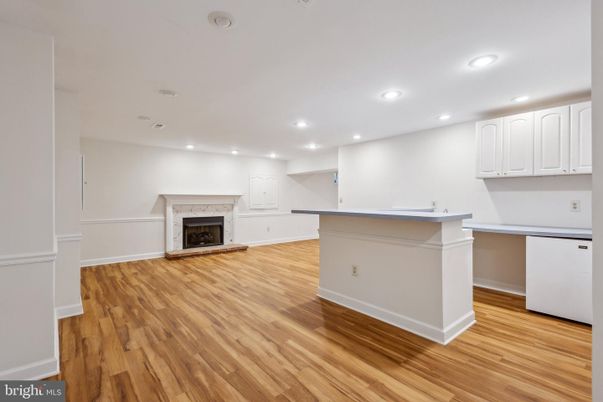 Fireplace, Interior, Kitchen, Recessed Lighting, Wood Texture Flooring