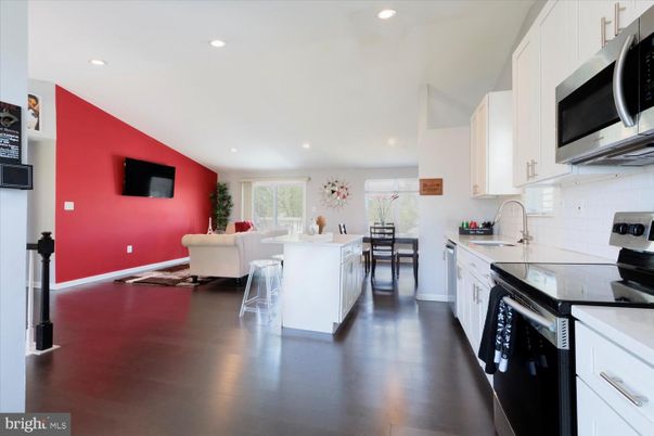 Dining room, Interior, Kitchen, Living room, Recessed Lighting, Stainless Steel Appliances, Wood Texture Flooring