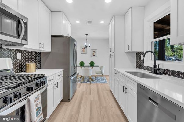Dining room, Interior, Kitchen, Pendant Lights, Recessed Lighting, Stainless Steel Appliances, Wood Texture Flooring