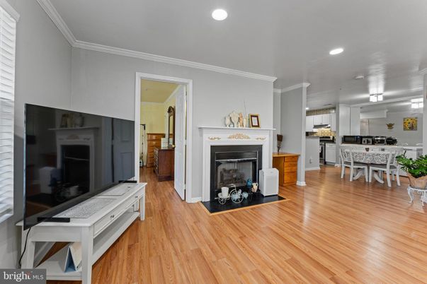 Dining room, Fireplace, Interior, Kitchen, Recessed Lighting, Wood Texture Flooring