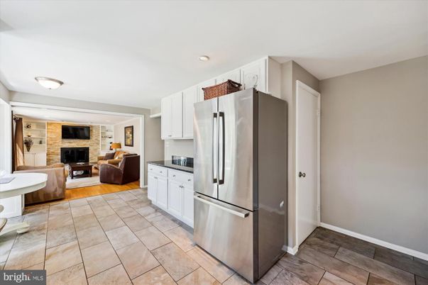 Fireplace, Interior, Kitchen, Living room, Recessed Lighting, Stainless Steel Appliances, Stone Walls, Wood Texture Flooring