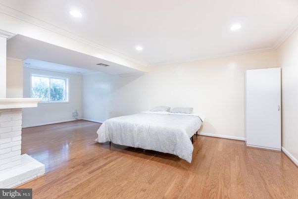 Bedroom, Fireplace, Interior, Recessed Lighting, Wood Texture Flooring