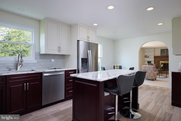 Fireplace, Interior, Kitchen, Recessed Lighting, Stainless Steel Appliances, Wood Texture Flooring