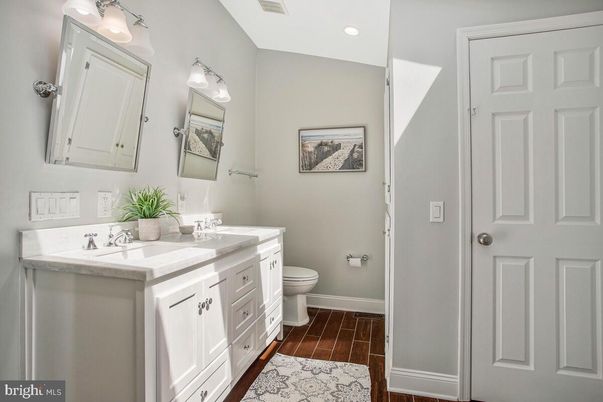 Bathroom, Dual Sink Vanities, Interior, Recessed Lighting, Wood Texture Flooring