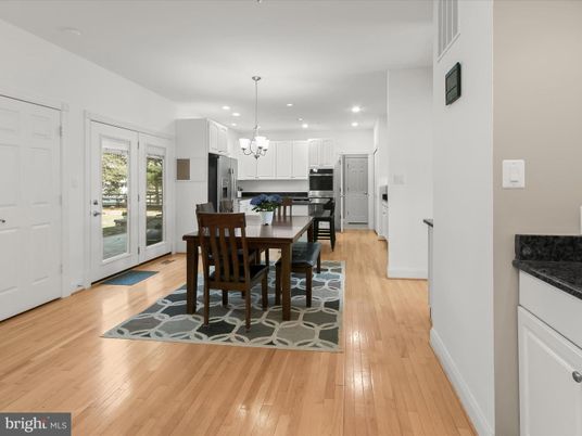Chandelier, Dining room, Interior, Kitchen, Pendant Lights, Recessed Lighting, Stainless Steel Appliances, Wood Texture Flooring