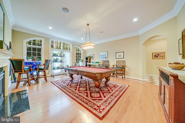 Billiard Table, Chandelier, Fireplace, Game Room, Interior, Pendant Lights, Recessed Lighting, Wood Texture Flooring