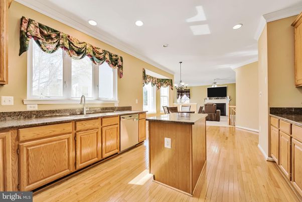Chandelier, Dining room, Fireplace, Interior, Kitchen, Recessed Lighting, Wood Texture Flooring