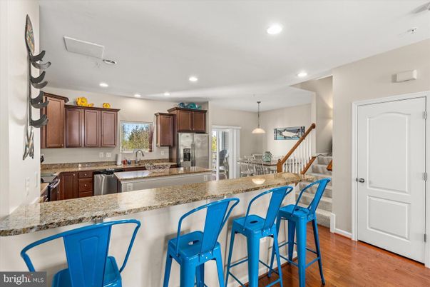 Dining room, Interior, Kitchen, Pendant Lights, Recessed Lighting, Stainless Steel Appliances, Wood Texture Flooring