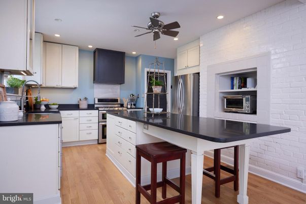 Interior, Kitchen, Recessed Lighting, Stainless Steel Appliances, Stone Walls, Wood Texture Flooring
