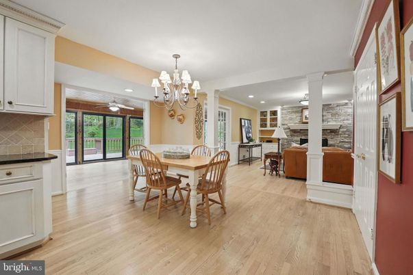 Chandelier, Dining room, Fireplace, Interior, Kitchen, Recessed Lighting, Stone Walls, Wood Texture Flooring