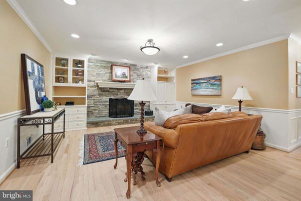 Fireplace, Interior, Living room, Recessed Lighting, Stone Walls, Wood Texture Flooring