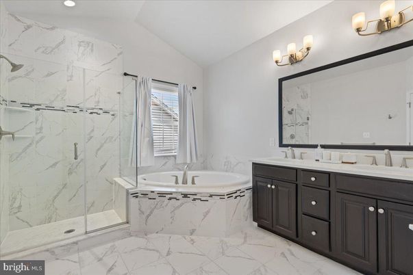 Bathroom, Dual Sink Vanities, Glass Shower, Interior, Marble, Marble Walls, Recessed Lighting