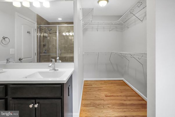 Bathroom, Glass Shower, Interior, Recessed Lighting, Walk-in Closets, Wood Texture Flooring
