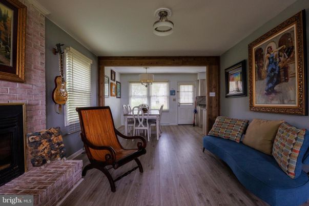 Dining room, Fireplace, Interior, Living room, Pendant Lights, Stone Walls, Wood Texture Flooring