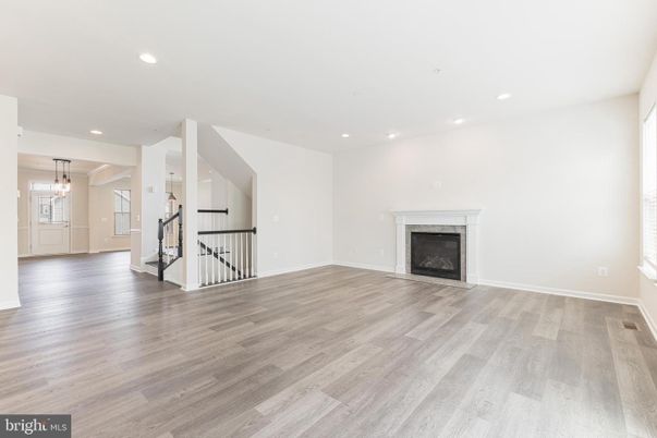 Empty room, Fireplace, Interior, Pendant Lights, Recessed Lighting, Wood Texture Flooring