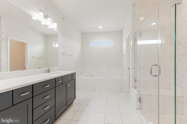 Bathroom, Dual Sink Vanities, Glass Shower, Interior, Marble, Marble Walls, Recessed Lighting