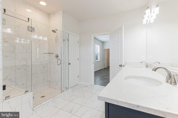 Bathroom, Dual Sink Vanities, Glass Shower, Interior, Marble, Marble Walls, Recessed Lighting