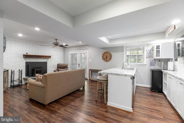 Fireplace, Interior, Kitchen, Living room, Recessed Lighting, Stone Walls, Wood Texture Flooring