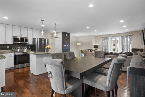 Dining room, Interior, Kitchen, Living room, Pendant Lights, Recessed Lighting, Stainless Steel Appliances, Wood Texture Flooring