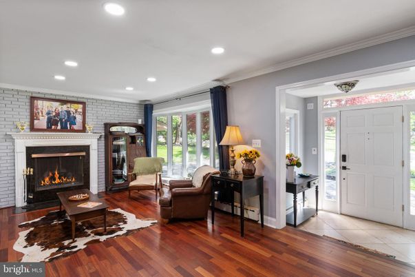 Fireplace, Interior, Living room, Recessed Lighting, Stone Walls, Wood Texture Flooring