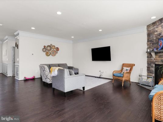 Fireplace, Interior, Living room, Recessed Lighting, Stone Walls, Wood Texture Flooring