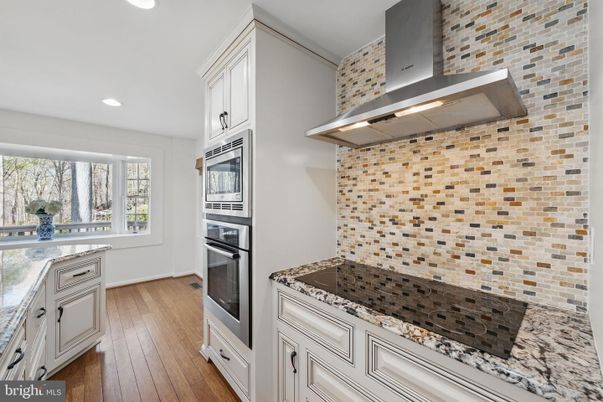 Interior, Kitchen, Recessed Lighting, Stainless Steel Appliances, Stone Walls, Wood Texture Flooring
