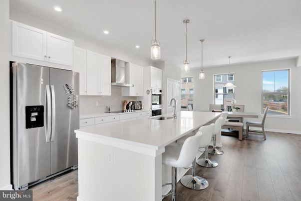 Dining room, Interior, Kitchen, Pendant Lights, Recessed Lighting, Stainless Steel Appliances, Wood Texture Flooring