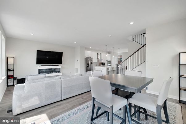 Dining room, Interior, Kitchen, Living room, Pendant Lights, Recessed Lighting, Stainless Steel Appliances, Wood Texture Flooring