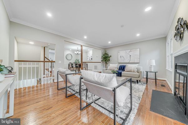 Dining room, Fireplace, Interior, Living room, Recessed Lighting, Wood Texture Flooring