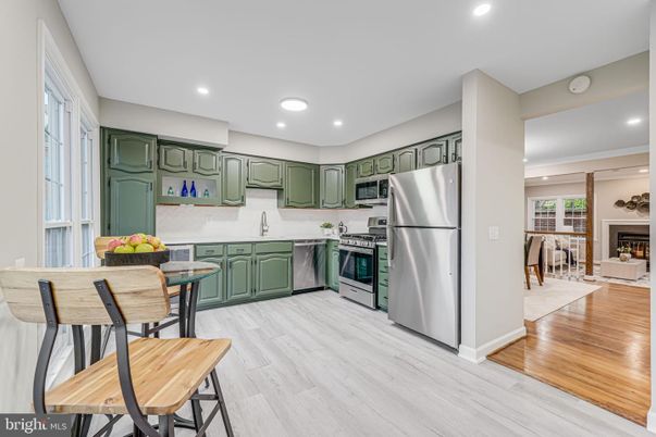 Fireplace, Interior, Kitchen, Recessed Lighting, Stainless Steel Appliances, Wood Texture Flooring